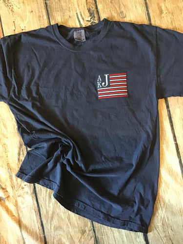 Navy comfort colors t-shirt with American Flag monogram embroidered on left chest 